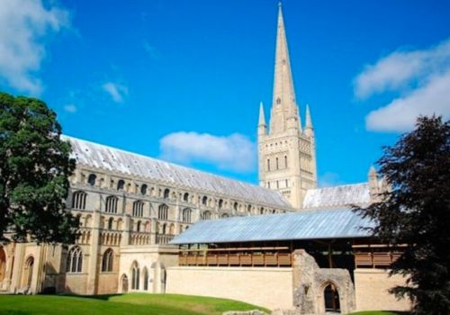 Norwich cathedral on blue sky sunny day